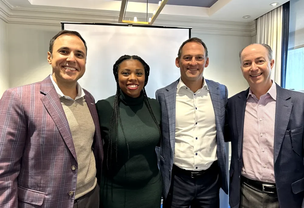 Four person smiling together