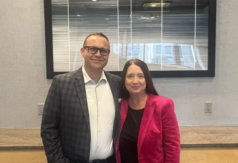 a man and a woman standing next to each other