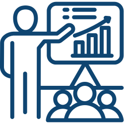 A human presenting to a group of people, engaging them with visual aids.